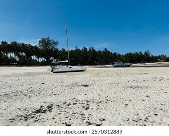 White sanded beach with cloudless clear blue sky