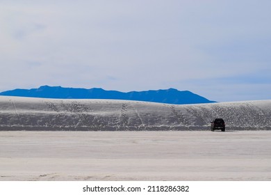 White Sands Landscape With Single Car Parked At The Base Of Dunes