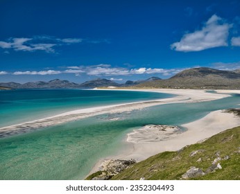 The white sands and turquoise waters of the pristine Luskentyre Bay in the Outer Hebrides. Taken on a sunny day in summer. - Shutterstock ID 2352304493