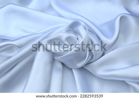 White satin smooth twisted fabric, top view.