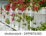 White Scalloped Vinyl Picket Fence with Flowers