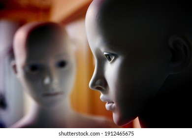 White Scary Mannequins Stand And Look At Each Other