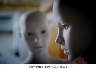 White Scary Mannequins Stand And Look At Each Other