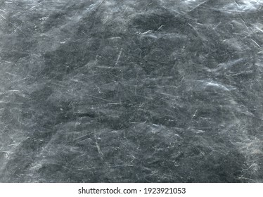 White Scratches And Dust On Black Background. Vintage Scratched Grunge Plastic Texture. Scratched Glass Surface Wallpaper. Space For Text