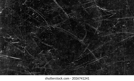 Arañazos blancos y polvo sobre fondo negro. Textura de pantalla rota de plástico raspado de color gris vintage. Papel de pared de vidrio rasgado. Espacio para texto.