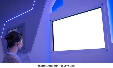 White Screen, Mock Up, Future, Copyspace, Template, Isolated, Technology Concept. Woman Looking At Blank Digital Interactive White Display Wall At Exhibition Or Museum With Futuristic Scifi Interior