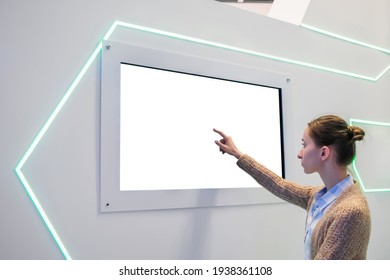 White Screen, Mock Up, Future, Copyspace, Template, Technology Concept. Woman Touching Blank Digital Interactive White Display Wall At Exhibition Or Museum With Futuristic Scifi Interior