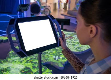 White Screen, Mock Up, Future, Copyspace, Template, Technology Concept. Woman Looking At Blank Interactive Touchscreen White Display Of Electronic Kiosk At Futuristic Exhibition Or Museum