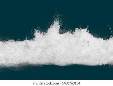 White sea spray against a dark blue background.  Space for copy. Turbulent ocean scene, with plain background.  Ideal for design. 
