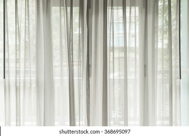 White see through window curtain in a home - Shutterstock ID 368695097