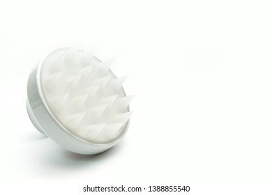 White Self Scalp Massager On The White Background