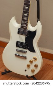 White SG Guitar On Stand