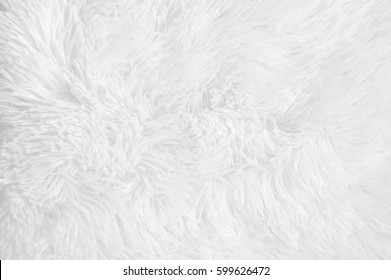 White Shaggy Blanket Texture As Background. Fluffy Fake Textile Fur.