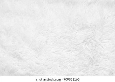 White Shaggy Blanket Texture As Background. Fluffy Fake Textile Fur.