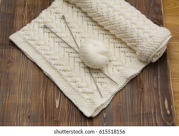 White shawl knitted on needles