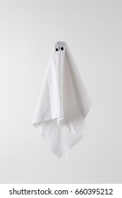 White Sheet Ghost Isolated On A White Background. Tones On Tones Photography