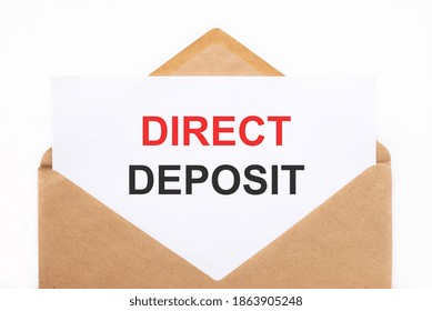 A White Sheet With The Text Direct Deposit Lies In An Open Craft Envelope On A White Background With Copy Space. Business Concept Image