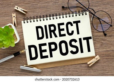 A White Sheet With The Text Direct Deposit Lies In An Open Craft Envelope On A White Background With Copy Space. Business Concept Image