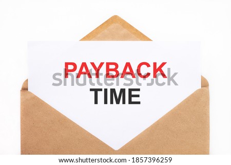 A white sheet with the text payback time lies in an open craft envelope on a white background with copy space. Business concept image