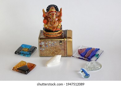 White Shell, Colored Glass, Box And Elephant Figurine On White Background As Background