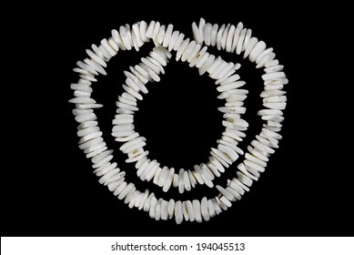 White Shell Necklace On A Black Background