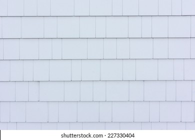 White Shingle Style Siding On A House Near The Coast