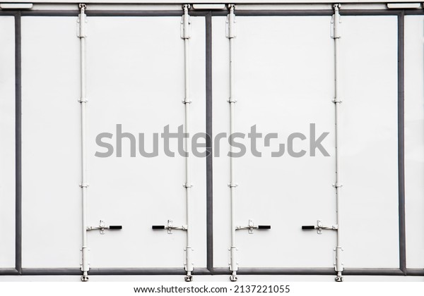 \
White Shipping Cargo Container Door. Safety\
Locked the Door of Cargo\
Transport
