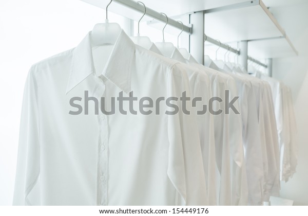 White Shirts Hanging On White Builtin Stock Photo 154449176 | Shutterstock
