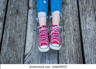 White Shoelaces On Red Sneakers. White Shoelaces, Way Of Lacing The Shoe. Tangled Shoelaces. To Tie A Knot. Educational Concept For Children.