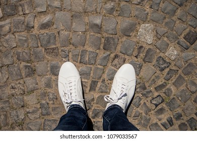 White Shoes On Sidewalk Texture.