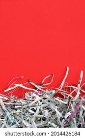 The White Shredded Paper On Red Background.