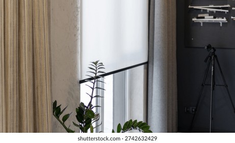 the white shutter on the window is down. window shading, store salon curtains