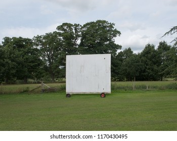 White Sight Screen On The Boundary Of A Village Cricket Pitch In Rural Devon, England, UK