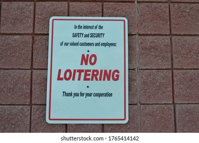 White Sign Outside Of A Gas Station Stating 