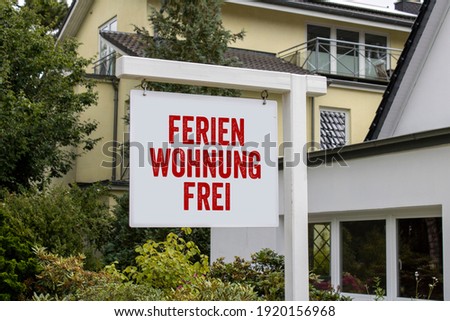 White sign with red letters and the german words for holiday appartment free - Ferienwohnung frei