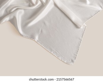 White Silk Scarf On Hand Isolated High Quality Image On Beige Background Ideal For Creating Mockup For Presentation Own Textile Design And Seamless Pattern