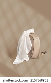 White Silk Scarf Tied To Backpack With Shadow Overlay High Quality Image On Beige Background Ideal For Creating Mockup For Presentation Own Textile Design And Seamless Pattern