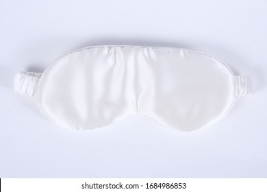 White Silk Sleeping Mask On A White Background