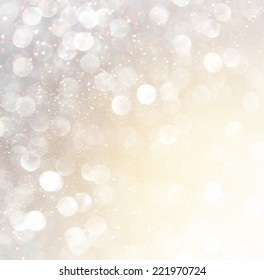 White Silver And Gold Abstract Bokeh Lights. Defocused Background 