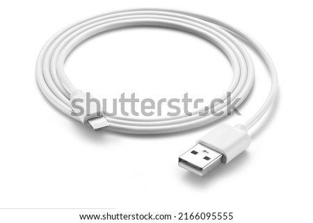 White simple USB lightning cable, rolled up, isolated on white background
