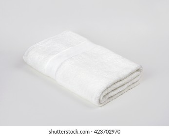 White Single Towel Folded On Gray Background