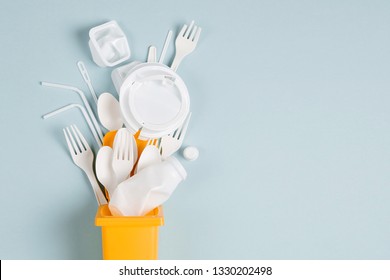 White single use plastic in garbage bin on  blue background.Concept of Recycling plastic. Flat lay, top view - Shutterstock ID 1330202498