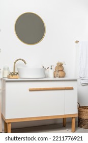 White Sink On Marble Counter With A Round Mirror Hanging Above It. Bathroom Interior. Copy Space