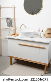 White Sink On Marble Counter With A Round Mirror Hanging Above It. Bathroom Interior. Copy Space