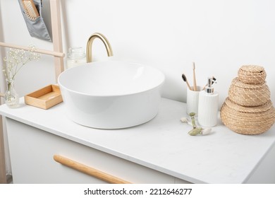 White Sink On Marble Counter With A Round Mirror Hanging Above It. Bathroom Interior. Copy Space