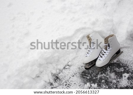 white skates in the snow