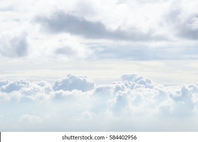 White Sky And Puffy Clouds