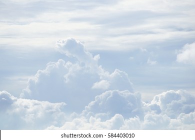 White Sky And Puffy Clouds