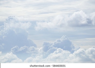 White Sky And Puffy Clouds