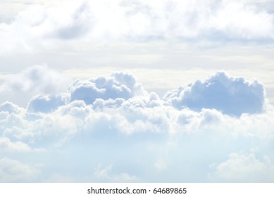 White Sky And Puffy Clouds